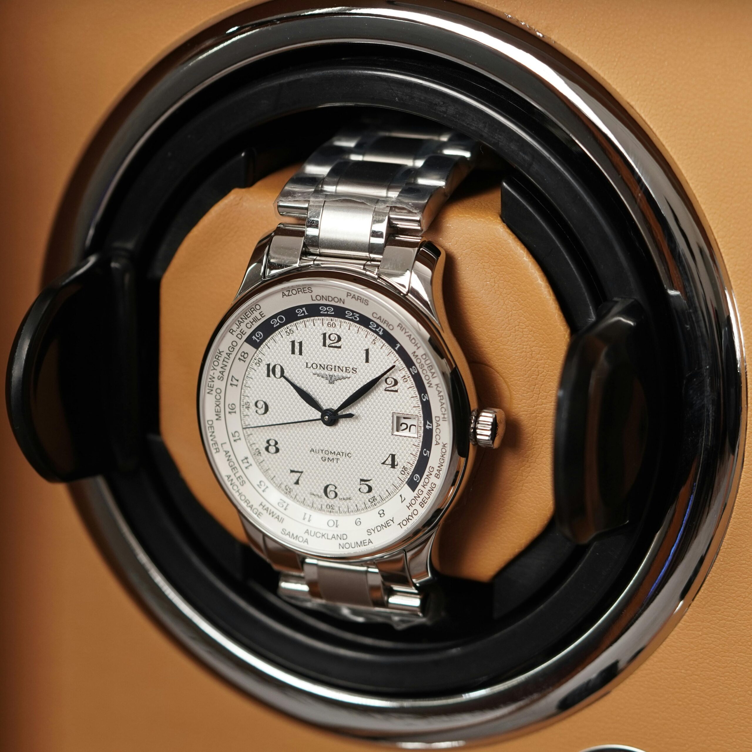 Close-up of a luxury wristwatch in a display case, showcasing elegance and precision.
